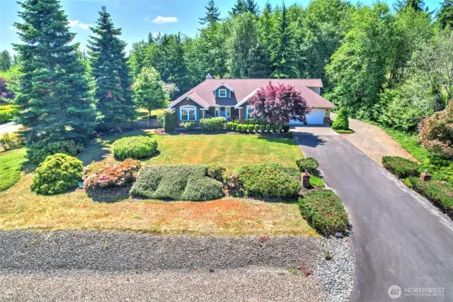 Just check out the street apeal on this corner 2.3 acre home.