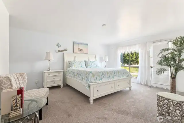 The expansive primary bedroom retreat . . .