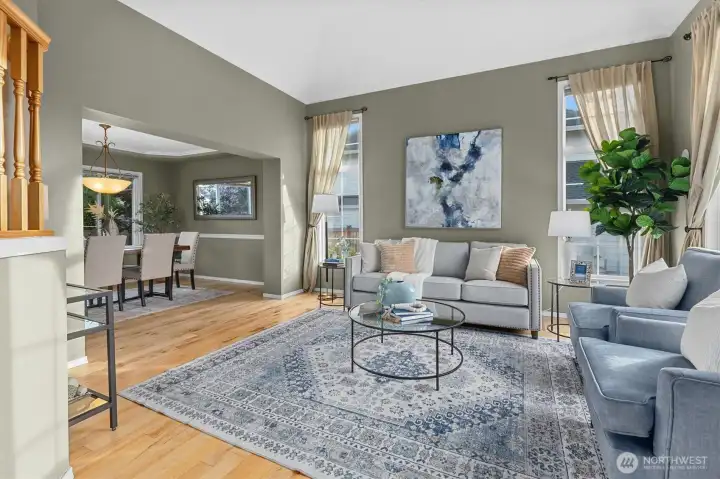 Vaulted ceiling and walls of windows in the living room.
