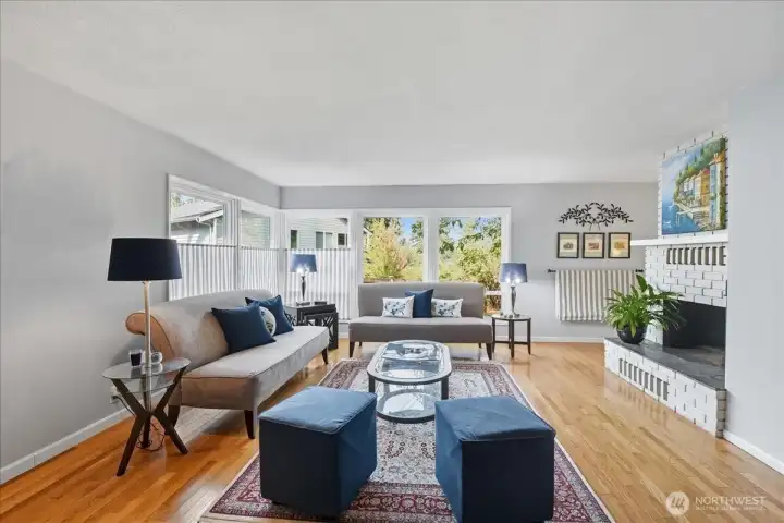 Natural light floods this cozy family room via the wall of windows!