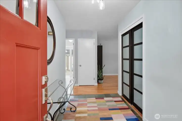 Beautiful red door and slate floors to greet your guests.