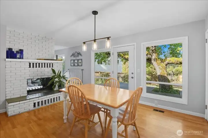 Great kitchen view of the double-sided fireplace and easy access to the back patio.