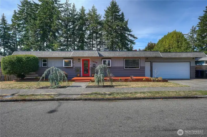 This Daylight Rambler boasts 4 bdrms & 3 full baths…2 car garage & off street guest parking…
