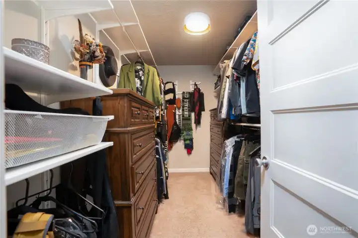 Spacious primary bedroom walk-in closet…