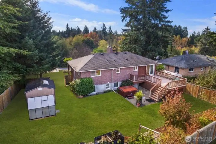 Drone shot of the Beautiful Manicured Yard and Deck