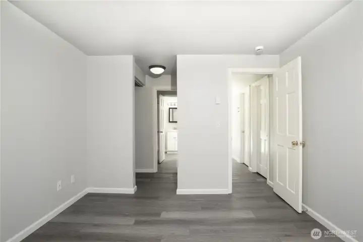 Primary bedroom with adjoining closet and bathroom