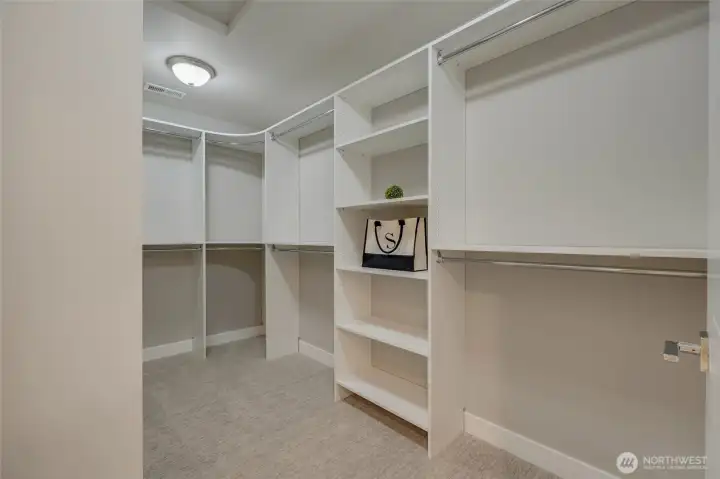 Completing the suite is a massive walk-in closet, thoughtfully designed to provide ample space for organizing and showcasing your wardrobe and accessories in style.