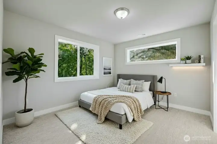 Four additional bedrooms provide both space and style, with expansive walk-in closets that cater to every storage need.  [Photo is virtually staged]