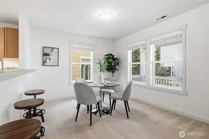 Dining area + kitchen (staged)