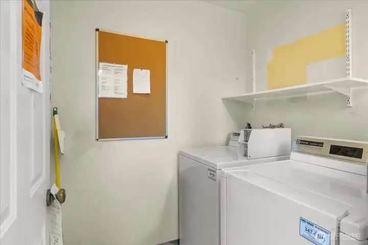 Shared laundry room beside carport