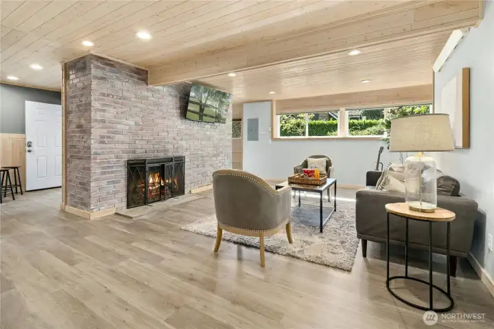 Lower level/ADU large living room with fireplace and loads of space.