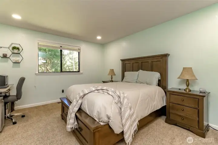 Primary bedroom overlooks the private backyard.