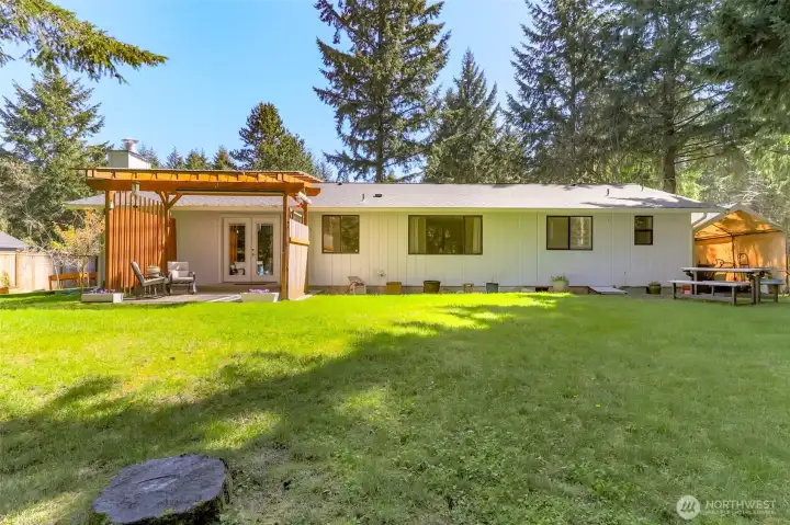 Carport to the far right for covered gardening or shaded play area.