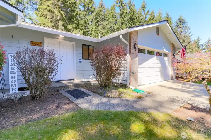 Welcoming double door entry with covered front porch.