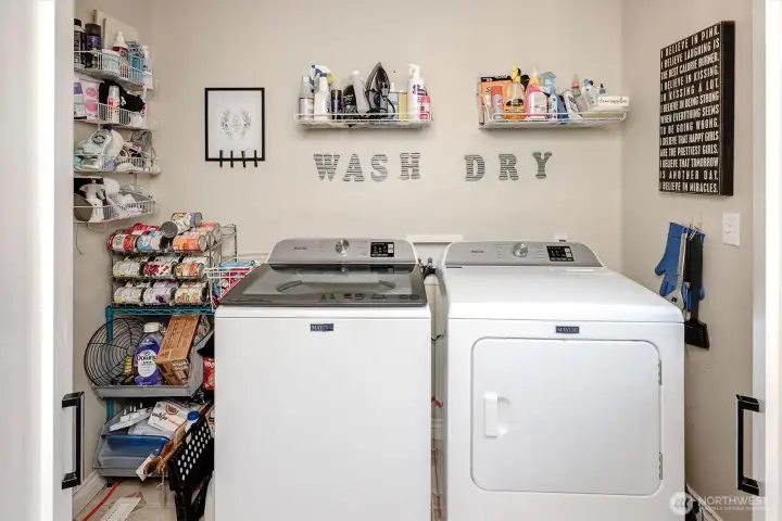 Laundry/storage room off kitchen has outside door!
