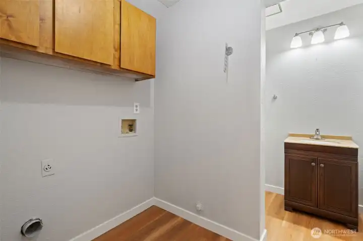 Downstairs laundry with half bath. Downstairs laundry with half bath.
