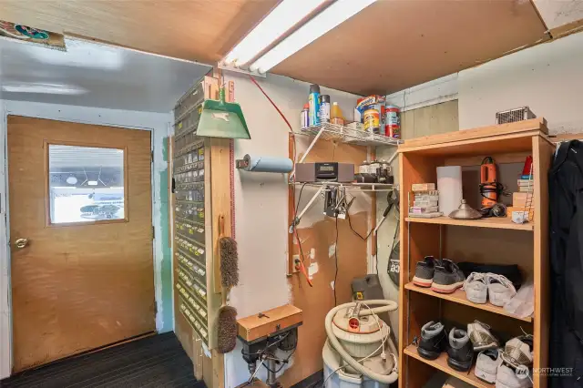 Wood shop room with door into garage.