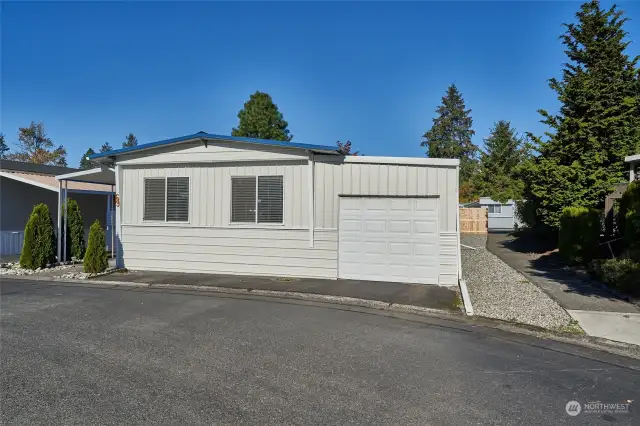 Front of home with rare one car garage.