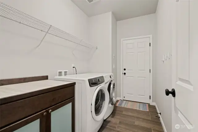 Laundry on main by stairs leading to flex space upstairs.