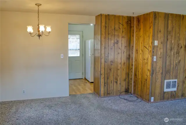 Living room has pretty wook paneling accent