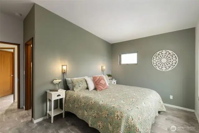 Spacious primary bedroom layout emphasizes restfulness and connection to the outdoors.