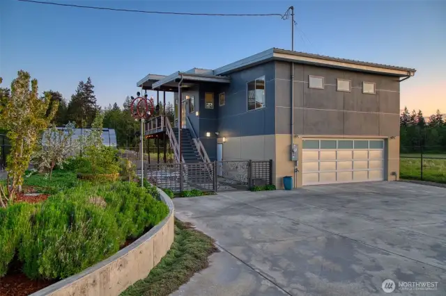 Magical dusk lighting brings warmth to the home’s clean lines and contemporary design.