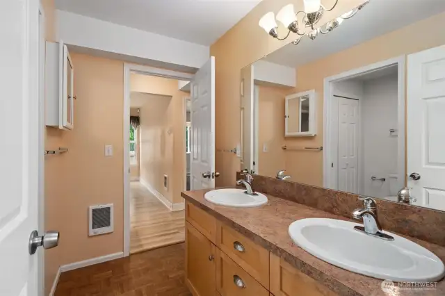 Bath has two doors-one to hallway and one from kitchen area