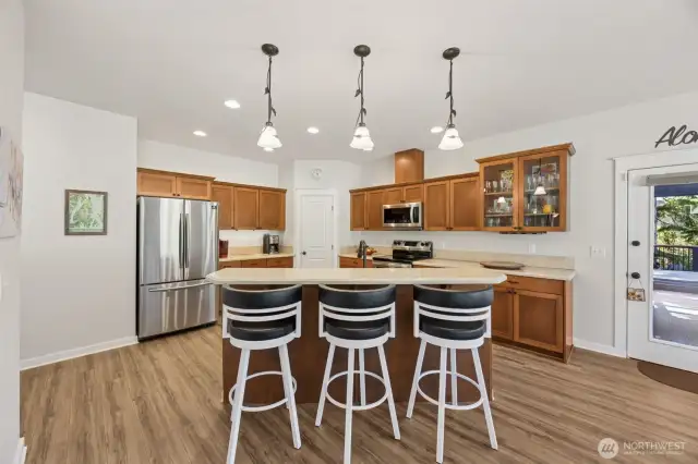 Beautiful maple kitchen with newer appliances, eating bar, and a walk-in pantry.