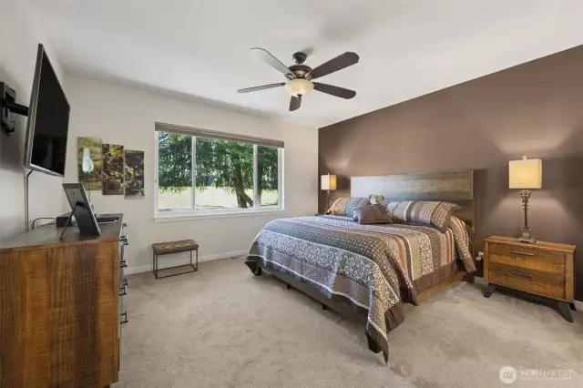 Primary bedroom overlooks the golf course and includes a 5-piece bath and walk-in closet.