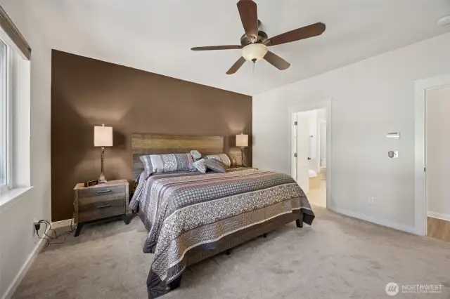Primary bedroom -- Custom blinds throughout the home.