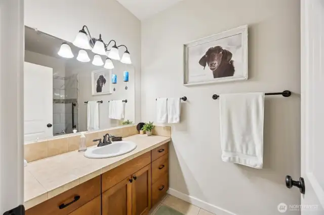 Main 3/4 bath is also fully tiled.