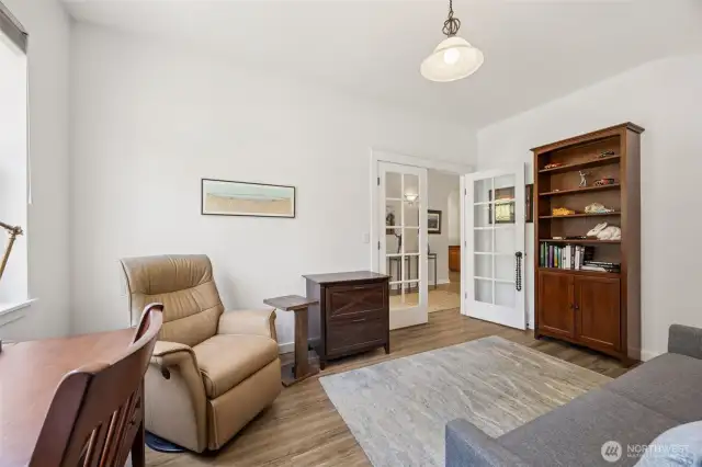 French doors lead to the large den off the entry.