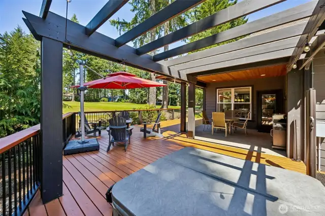 This is a large outdoor space for entertaining and includes a hot tub!