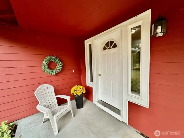 Charming, covered porch greets visitors and provides a wonderful place to sit a spell.