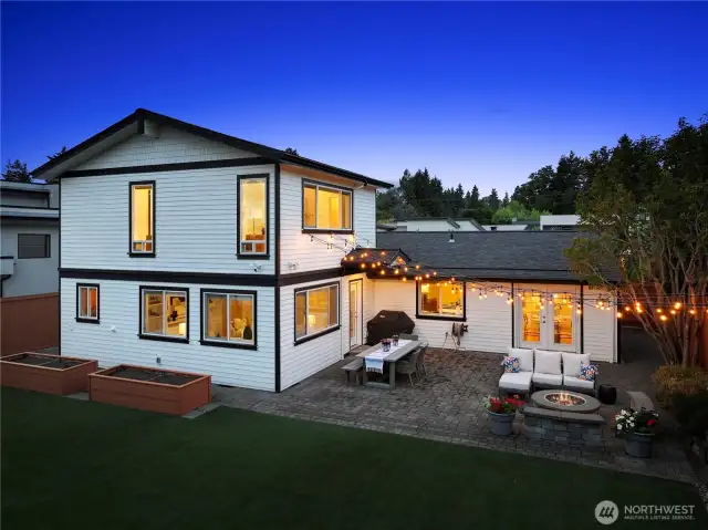 Charming entertainer's patio. Paver stones and built in gas fire pit. Bistro lights and patio table plus BBQ make it a fabulous place to spend the evening. The primary suite encompasses all of the second story in this home. Vaulted ceilings in the primary bedroom, bath, and walk-in closet. Very unique and bougie.