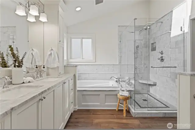 Marble slab on the double vanity ad tub deck.