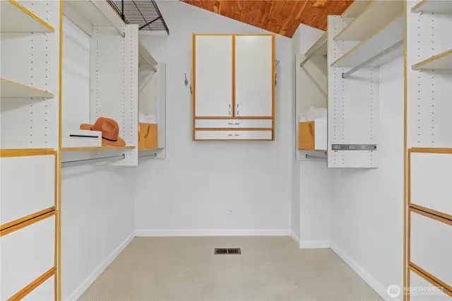 Big primary walk-in closet with a vaulted ceiling for lots of extra room for storage.