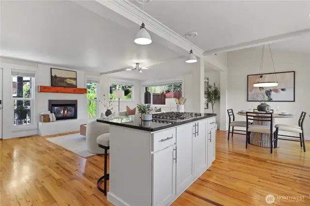 Dining area offers several options for a table. A round fits nicely in this space. However, it can accommodate a larger oval or rectangular table and can extend between to two columns.