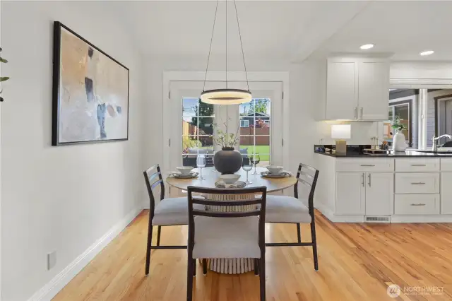 Dining with French doors that lead to the back patio.