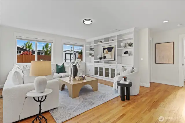 Bonus room was added on sometime ago but lives very fresh and updated. Great built-in shelving for toys, games, books, and TV. 3/4 bathroom to the right and laundry room to the left.