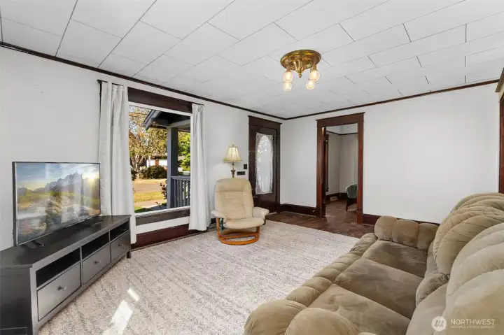 View of the front door and front bedroom