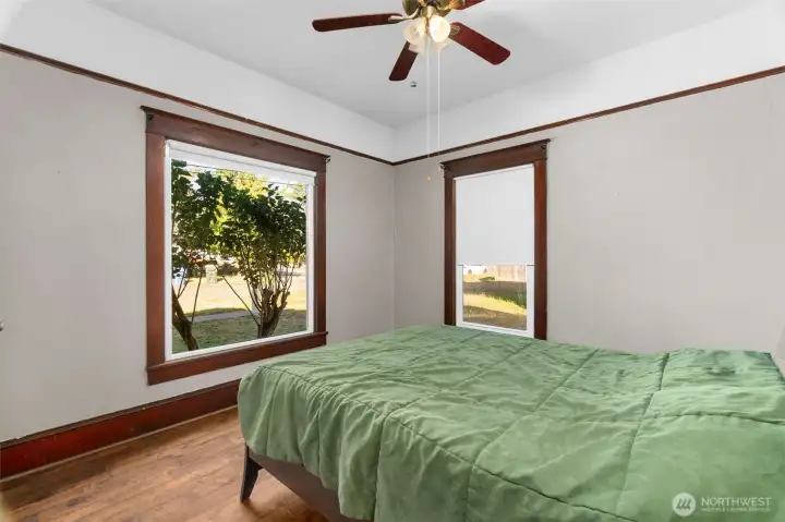 Front Bedroom with ceiling fan and large windows