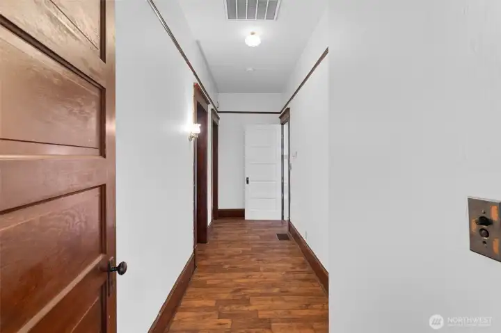 Hallway to second bedroom & bathroom. This is where you could install stairs if you wanted to build out the unfinished attic.
