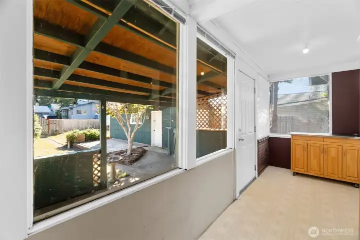 Back door of ~120 SQFT enclosed porch/laundry/mud room