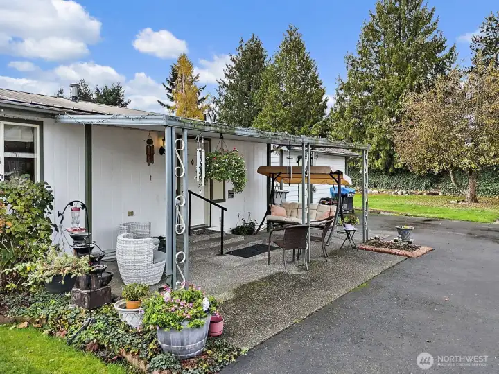 Year round enjoyment with the covered porch and beautiful yard
