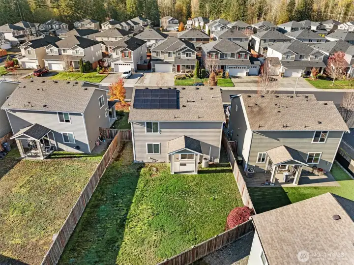 Aerial view showcasing energy-saving solar panels. Your electric monthly payments will be very low.