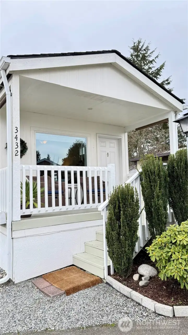 A lovely spot to enjoy a cup of coffee! There are even custom shades on each end to keep things cool.