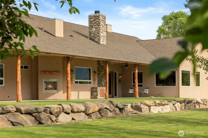 Covered back patio with fireplaces, propane hookups, utility sink w/ hot and cold water and more.