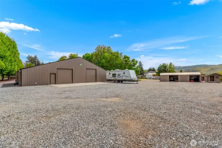 3,000+ sq ft shop with full bathroom, Washer/Dryer, central HVAC, heavy-duty/upgraded electrical service, bonus room and oversized doors for parking your large RV indoors! 3,000+ sq ft shop with full bathroom, Washer/Dryer, central HVAC, heavy-duty/upgraded electrical service, bonus room and oversized doors for parking your large RV indoors!