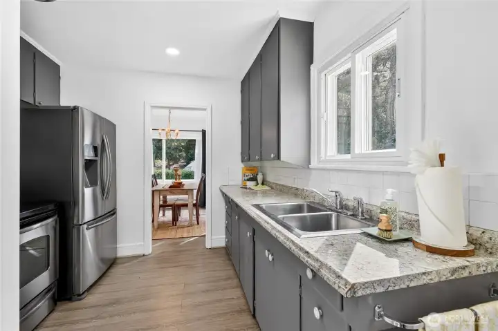 Kitchen features Stainless-Steel Appliances that stay for new owners.